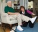 physical therapy assistant helps blind patient through leg exercises