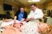 Matt Hoffman, M.D., MPH, director of OB/GYN Education & Research (right), instructs OB/Gyn resident Alexandra Gold, M.D., in the Virtual Education and Simulation Training Center.