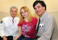 Leukemia patient Kallie Roberts, with Nicholas J. Petrelli, M.D., Bank of America endowed Medical Director of the Helen F. Graham Cancer Center (left), and Medical oncologist, Michael J. Guarino, M.D.