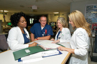 Kellee Sorrell, Paul Koscinski, Heather Conrad, and Crystal Ricketts discuss patient plans of care.