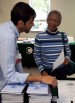 Amit Patel, M.D., speaks with Doris Murphy about nutrition at a health fair at Wilmington Senior Center.