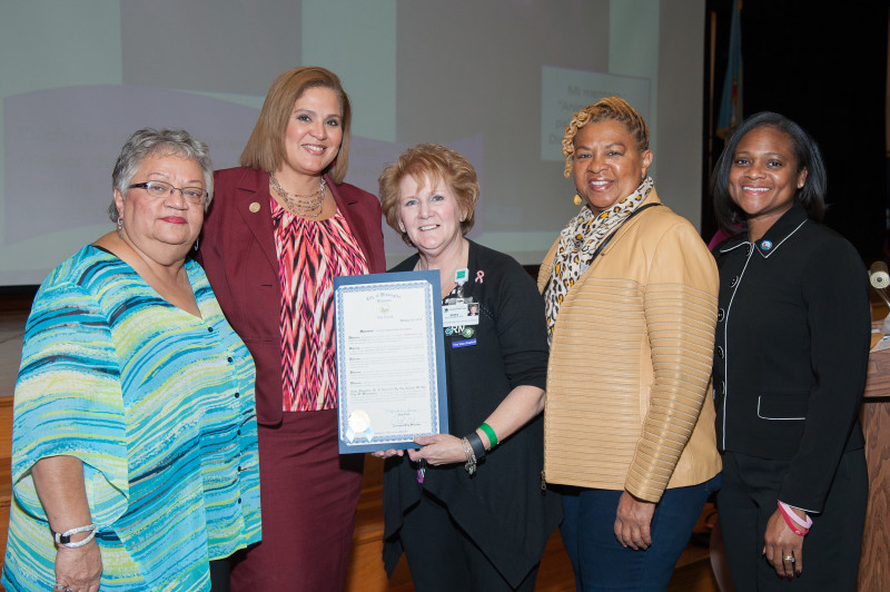 Joined by Latin American Community Center President Maria Matos and Wilmington City Councilwomen Maria Cabrera, Hanifa Shabazz and Sherry Dorsey Walker, Nora Katurakes, MSN, RN, OCN, Christiana Care’s manager of Community Health Outreach & Education and co-leader of the event, displays a proclamation for outstanding work presented by the City Council to Christiana Care. 
