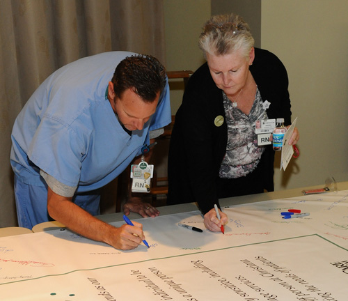 man and woman signing pledge