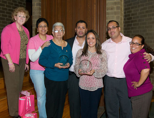 group of latina family with award