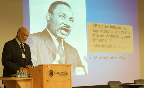 adewale troutman speaking at global health symposium