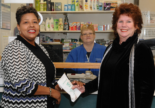 Carlette Dickerson, pharmacy program coordinator, and Bev Blades, pharmacy technician, assist Margaret Graber at the Wilmington Hospital outpatient pharmacy.