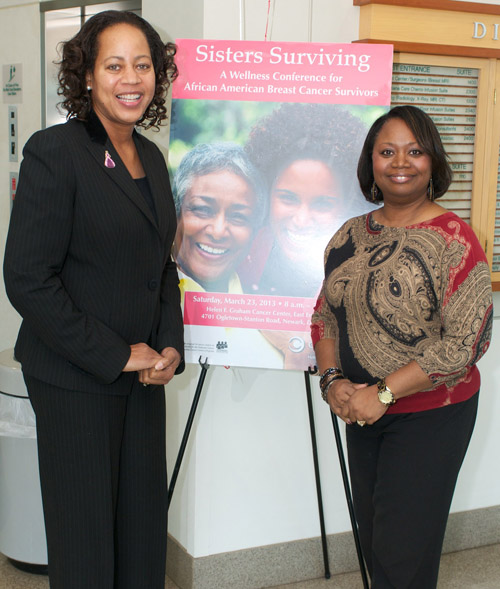 Sheila Walton-Moore, cancer free for eight years, with friend Jennifer Grace-Umoete, at Sisters Surviving, a Wellness Conference for African-American Breast Cancer Survivors.