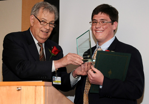 Nick Dilenno receives the Spirit of Women Young Person RoleModel from Richard Derman, M.D., MPH, FACOG, Marie E. Pinizzotto, M.D., Endowed Chair of Obstetrics and Gynecology.