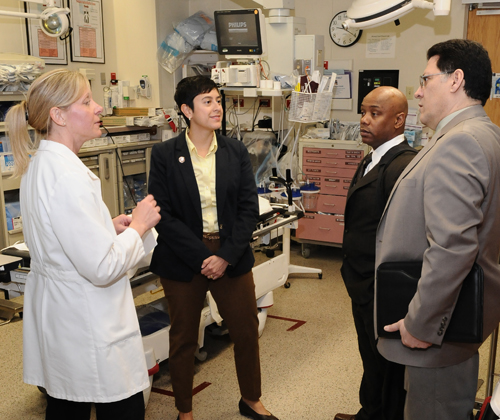 Christiana Hospital trauma surgeon Sandra Medinilla, M.D., and  Joan Pirrung, APRN-BC, Christiana Hospital Trauma Program manager, talk with Timothy White, a violence interrupter and National Community Technical Assistant Coordinator for Cure Violence, and Frank Perez, MA, National Director of Outreach Services for Cure Violence, during a tour of Christiana Hospital’s trauma floor, trauma bays and Surgical Critical Care Complex.