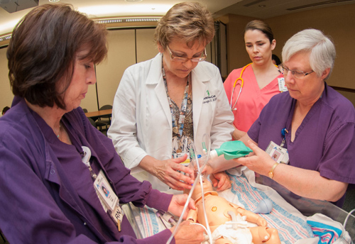Christiana Care Neonatal Nurse Practitioner Linda Marsiglia uses Baby HAL to instruct nurses of Union Hospital's maternity department.