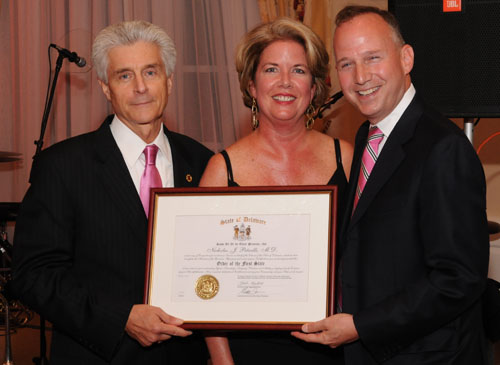 Gov. Jack Markell and First Lady Carla Markell present Nicholas Petrelli, M.D., Bank of America endowed medical director of the Helen F. Graham Cancer Center & Research Institute, with the Order of the First State during the Friends of the Helen F. Graham Cancer 10th anniversary celebration.