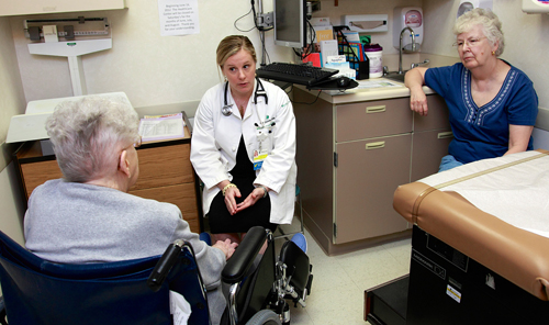 Allison K. Buonocore, M.D., meets with a patient and a family member. Primary care practices will be important partners in leveraging research to help patients.