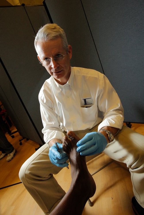 Paul Kupcha, M.D., provides a free foot examination.
