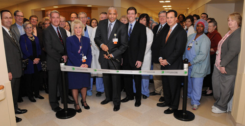 Joined by physicians, nurses, staff, leaders and many of the donors who helped to make the new facility a reality, Edmondo Robinson, M.D., MBA, physician-in-chief, Christiana Care Wilmington, cuts the ribbon to open 13 new operating rooms and more at Wilmington Hospital.