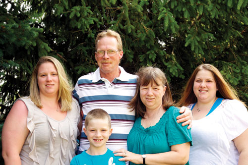 Stroke survivor John Hetherington with his family.