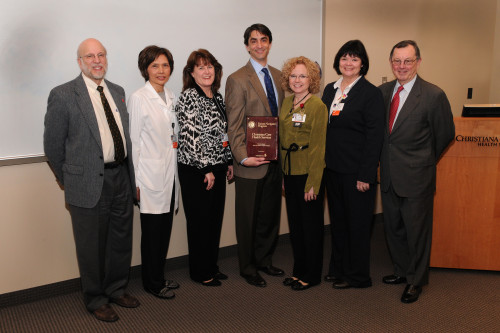 William Weintraub, M.D., chief of cardiology and director for the Christiana Care Center for Outcomes Research; Maria Albert, program manager; Patti Resnik, vice president of Quality and Patient Safety; Larry Narun,  M.D., medical director of the Cardiology Short Stay Unit; Carolyn Moffa, family nurse practitioner; Mary Zita Guest, RN; and Tim Gardner, M.D., executive director of the Value Institute and medical director of the Center for Heart & Vascular Health. Dr. Narun, Albert, Resnik, Moffa and Zita Guest are part of a multidisciplinary team that will carry out the Patient Navigator Program. Mitch Saltzberg, M.D., (not pictured) medical director of Christiana Care’s heart failure program, will lead the program.
