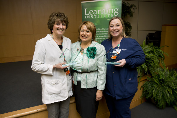 Rosa Colon-Kolacko, Ph.D., MBA, senior vice president, System Learning/Learning Institute, and chief diversity officer, presents Cheryl Swift, BS, MSN, RNC-OB, and Danielle Sofia, BSN, RN, CCRN, with Rising Star Educator awards.