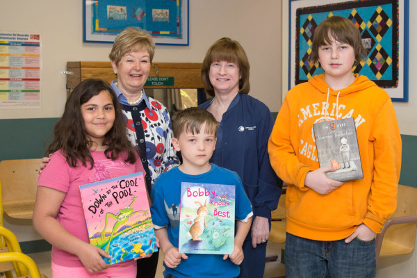 The Junior Board of Christiana Care donated children's books to the Wilmington Health Center.