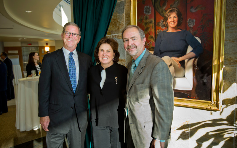 Gary Pfeiffer, board chair of Christiana Care, and Robert J. Laskowski, M.D., MBA, president and CEO, with Carol Ammon at the unveiling of her portrait at Wilmington Hospital.