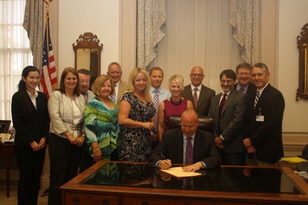 Gov. Jack Markell signs the Academic Licensing for Dentistry bill, which strengthens the license of dentists to academic license from limited license, enabling dentists to work as directors, chairs or faculty of hospitals.