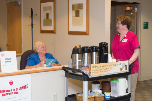 With her hospitality cart, Fran Tebbutt of WIlmington provides refreshments to hospital visitors.