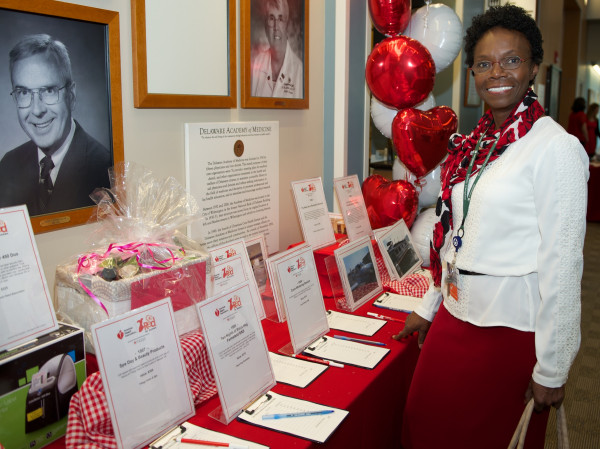 Velma P. Scantlebury, M.D., FACS, associate chief of transplant surgery at Christiana Care, browses through the silent auction items at the Go Red for Women luncheon.