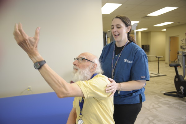 Laurie Scott, OTR/L, works with patient Jim Weiher during a session of (LSVT) BIG therapy.