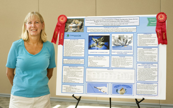 Sharon Botts-DiMucci, BSN, RN, with her second-place winning poster “Robot-Assisted Laparoscopic Hysterectomy in Obese and Morbidly Obese Women: Surgical Technique and Comparison with Open Surgery.”