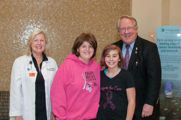 Alexis Everett and her mother, Veronica Everett, pose with Diana Dickson-Witmer, M.D., FACS, and Greg R. Pahnke, M.D., from Veronica’s medical team.