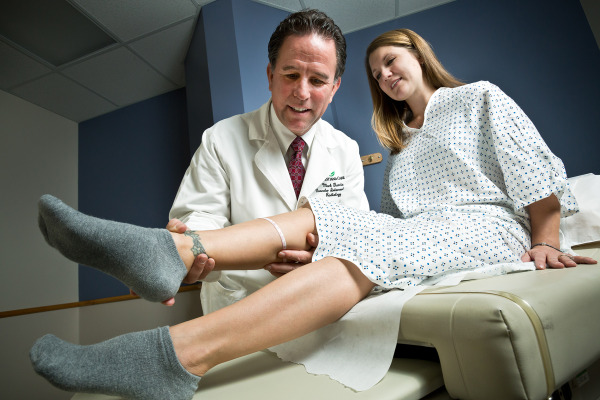Mark J. Garcia, M.D., MS, FSIR, examines a patient at the new Center for Comprehensive Venous Health.