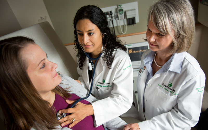 Meenakshi A. Bhalla, M.D., and Susan Felicia, MSN, PNP-C, CHFN, examine a patient at the Christiana Care Center for Heart & Vascular Health.