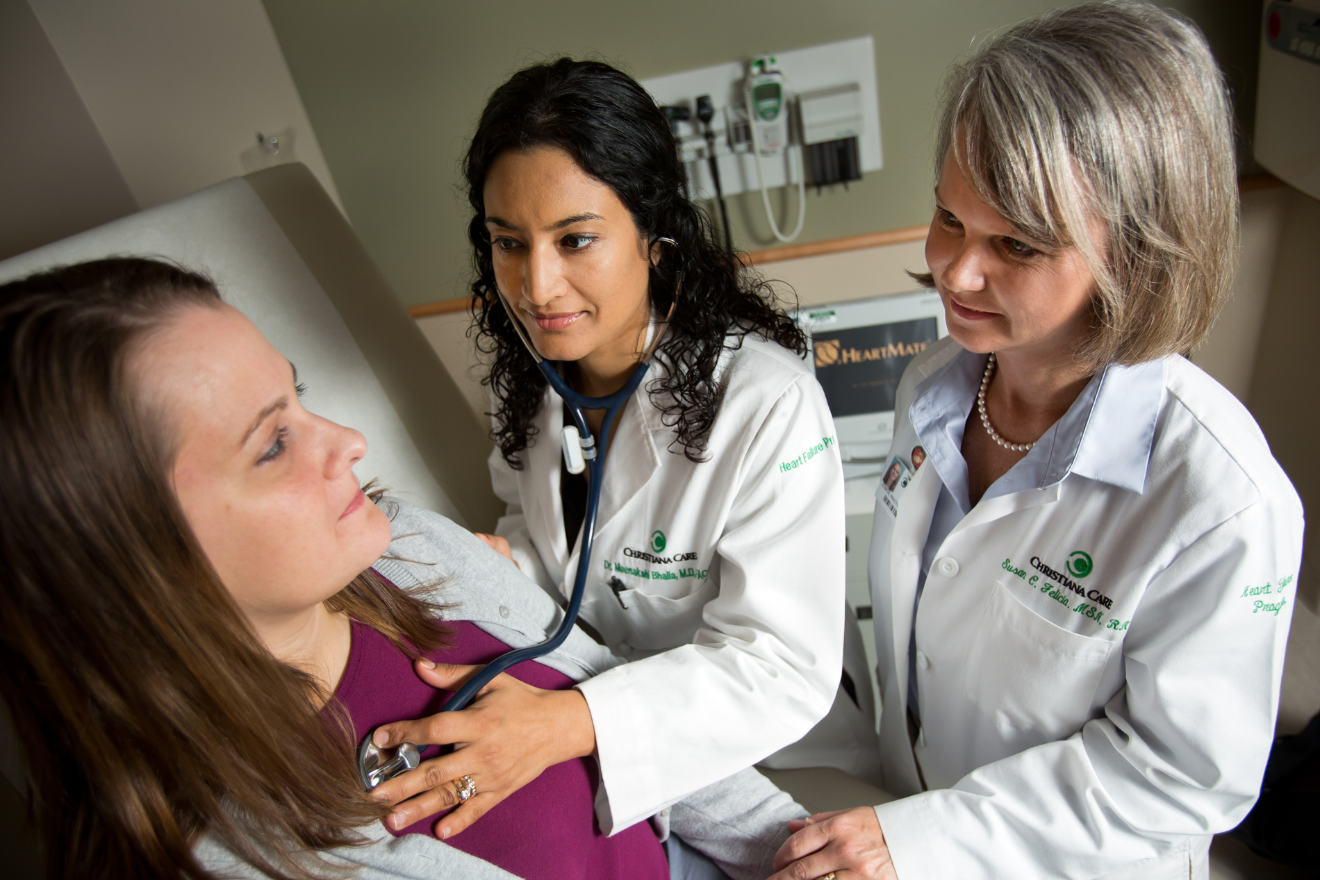 Meenakshi A. Bhalla, M.D., and Susan Felicia, MSN, PNP-C, CHFN, examine a patient at the Christiana Care Center for Heart & Vascular Health.