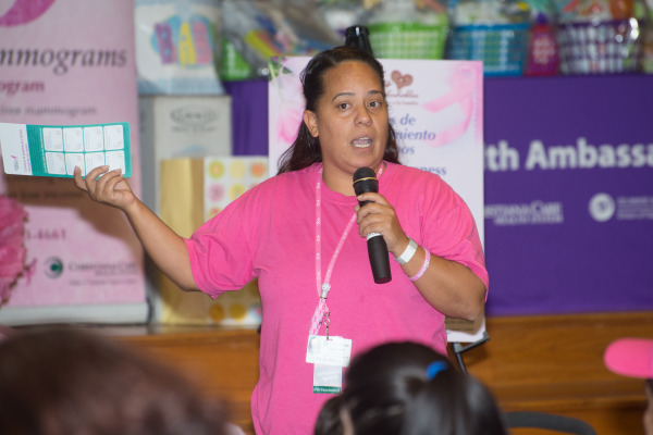 Joceline Valentin, coordinator of the Latina Conference, talks to the audience about screenings and breast health.