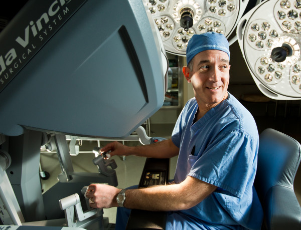 Jeffry Zern, M.D., demonstrates the controls of the da Vinici Robotic Surgery System.