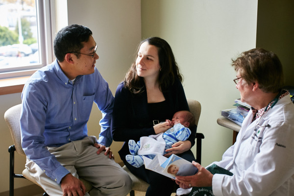 Pediatrician Shirley Klein, M.D., meets with a new family at the Rocco A. Abessinio Family Wilmington Health Center, where the entire care team is involved in supporting parents to give their babies a healthy start.