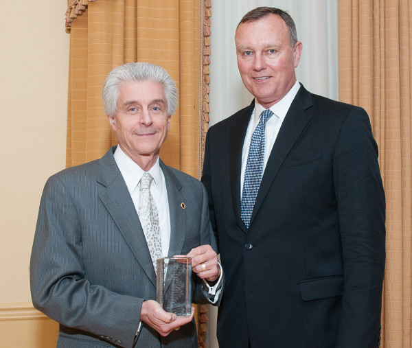 Nicholas Petrelli, M.D., Bank of America endowed medical director of the Helen F. Graham Cancer Center & Research Institute, receives the 2015 Service Award from AstraZeneca’s William Mongan at the Delaware Bio Science Association awards gala.