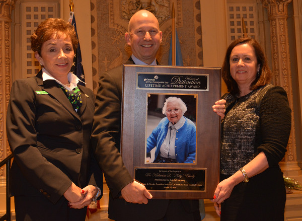 Anne T. Hogan, CEO of Girl Scouts of the Chesapeake Bay, Delaware Governor Jack Markell and Christiana Care President and CEO Janice E. Nevin, M.D., MPH, hold the plaque recognizing the late Dr. Katherine “Kitty” Esterly as a Women of Distinction honoree.