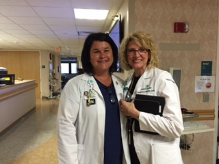Lauri Littleton, MSN, RN-BC, nurse manager of 4C, completed the 100,000th patient experience round with iRound on May 21, celebrating with Pam Boyd, MSN, RN, CNOR, senior program manager, Patient Experience.