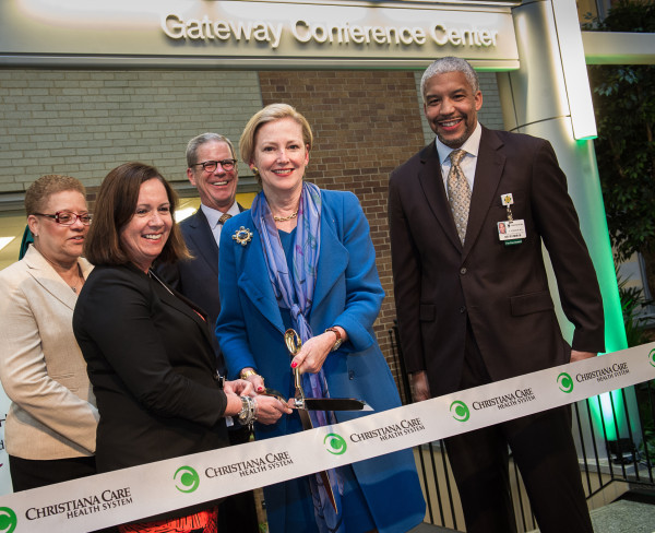 Christiana Care President and CEO Janice E. Nevin, M.D., MPH, and DuPont Chair and CEO Ellen Kullman cut the ribbon on the Wilmington Hospital Gateway Building. They are joined by Sylvia Banks, Government Affairs Program manager, DuPont; Gary Pfeiffer, Christiana Care board chair, and Edmondo J. Robinson, M.D., MBA, FACP, senior vice president and executive director, Christiana Care - Wilmington, and assistant chief medical officer.