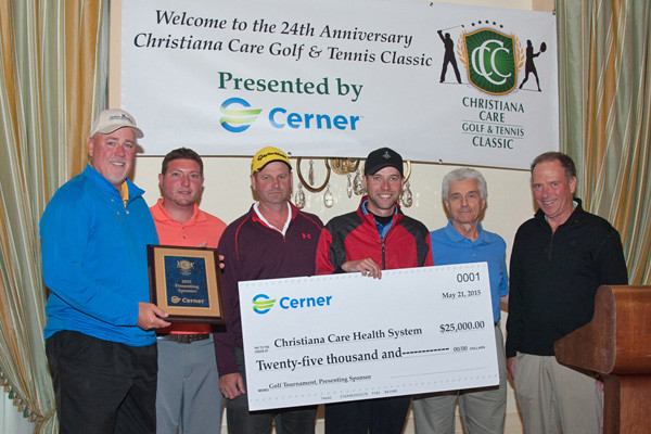 The Cerner Golf Classic team, including Bob Hamer, Mark Santichen, Brett Vickroy and Bart Vickroy, presented a check to Nicholas J. Petrelli, M.D., Bank of America endowed medical director of the Helen F. Graham Cancer Center & Research Institute, and Gary Ferguson, Christiana Care executive vice president and chief operating officer.