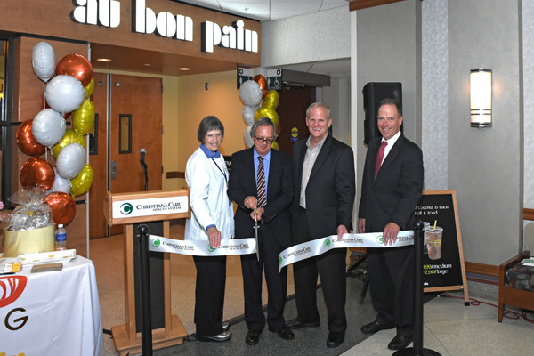 Cutting the ribbon to open the Christiana Hospital Au Bon Pain: Deborah Learn Alchon, Christiana Care corporate director of Food and Nutrition Services; Gary Ferguson, Christiana Care Health System chief operating officer; Brian Wright, Au Bon Pain chief operating officer; and Ray Seigfried, senior vice president of Administration, Clinical and Materiel Operations. 