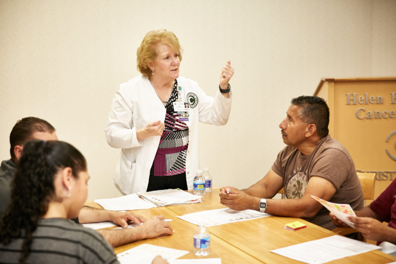 Nora Katurakes, RN, MSN, OCN, manager of Community Health Outreach and Education at the Graham Cancer Center, leads an annual community outreach meeting on skin cancer focusing on incidence among people of color.