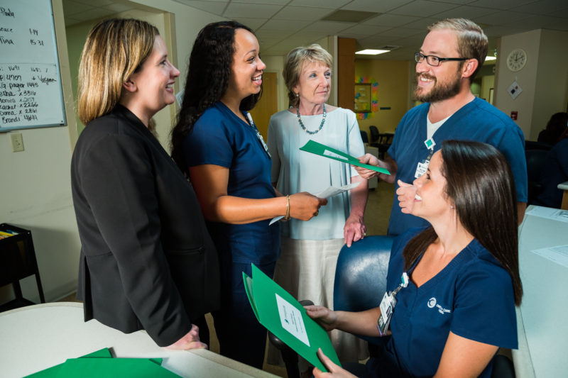 1888 Society member Cathi Hodgins (center) meets with nurses who are advancing their education. "The health system is like a family to me," said Hodgins, "and I especially wanted to support its excellent nursing staff.”
