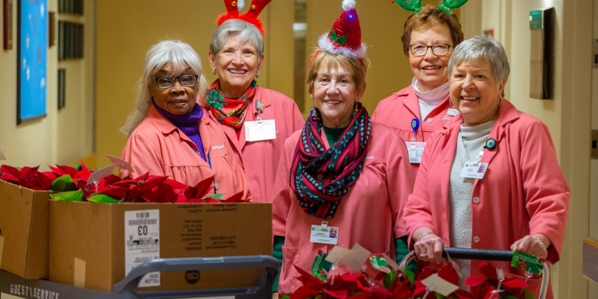 Junior Board of ChristianaCare spreads holiday cheer with poinsettias for patients